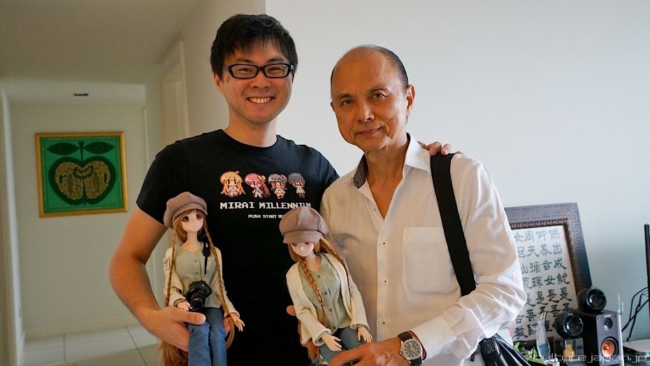 Malaysian designer Jimmy Choo poses with his son, Danny Choo after